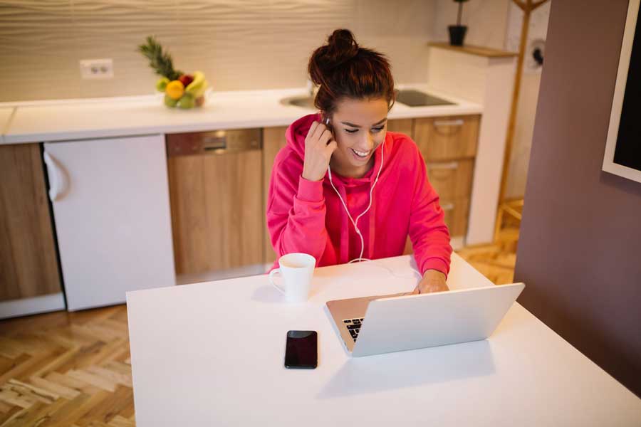 Student enjoys an online theology class at St Augestine's