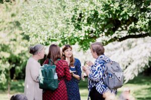 Theology students enjoy a discussion in the grounds of Malling Abbey in Kent on an induction day.