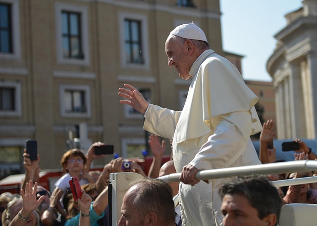 Pope Francis greeting people.